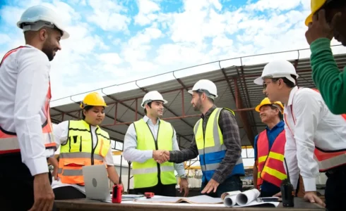 Construction workers gathered for a toolbox talk safety meeting