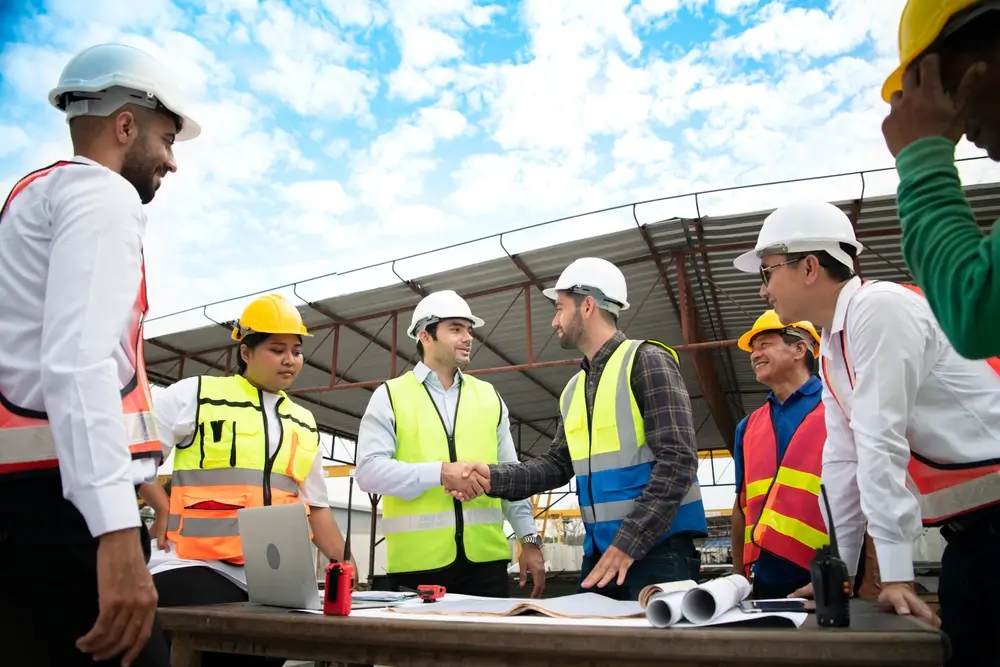 Construction workers gathered for a toolbox talk safety meeting
